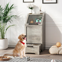 Modern gray pet food cabinet with elevated dog bowls and storage for food and toys.