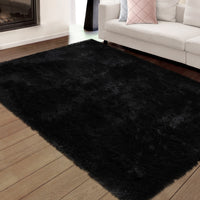 Modern black shag rug with plush texture, non-slip base, perfect for cozy spaces.